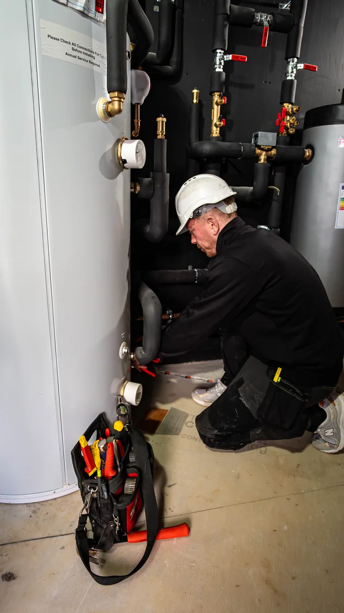 M&W Plumbing and Heating team working in Jersey